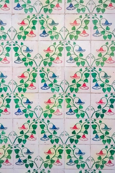 Portuguese azulejo tiles, floral vine motif in blue, green and pink, traditional faience pattern
