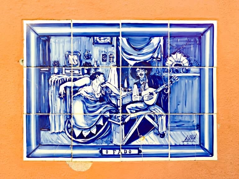 Lisbon. Tiles (Azulajos showing Fado singers on a building in Alfama