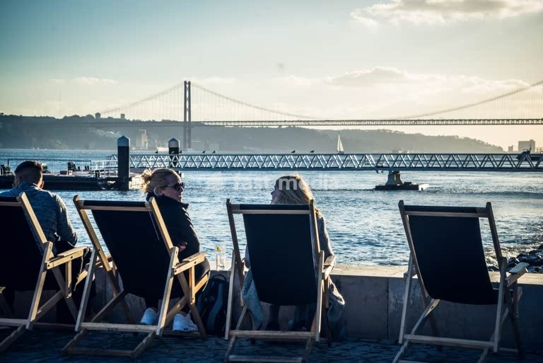 Lisbon, Portugal - Famous bridge Ponte 25 de Abril in the background. It spans 2277,64 m across river Tagus.