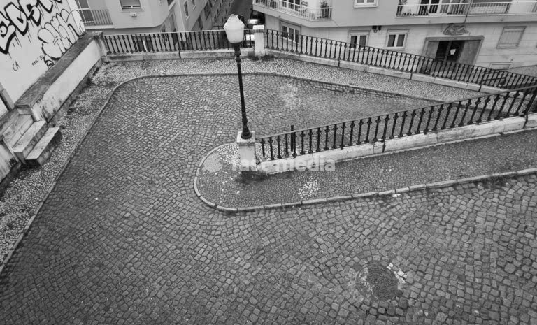 Lisbon, Portugal. Drive-up to Praça do Príncipe Real with traditional cobblestone and gas light