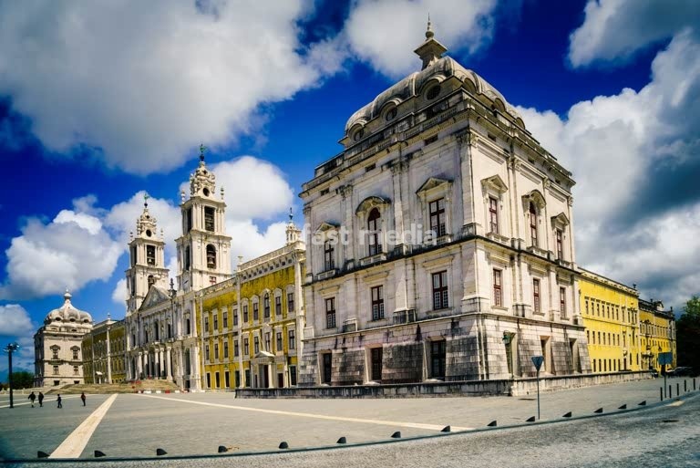 Mafra National Palace, Portugal. Grand baroque and neoclassical royal complex with basilica and twin towers under a blue sky. UNESCO World Heritage
