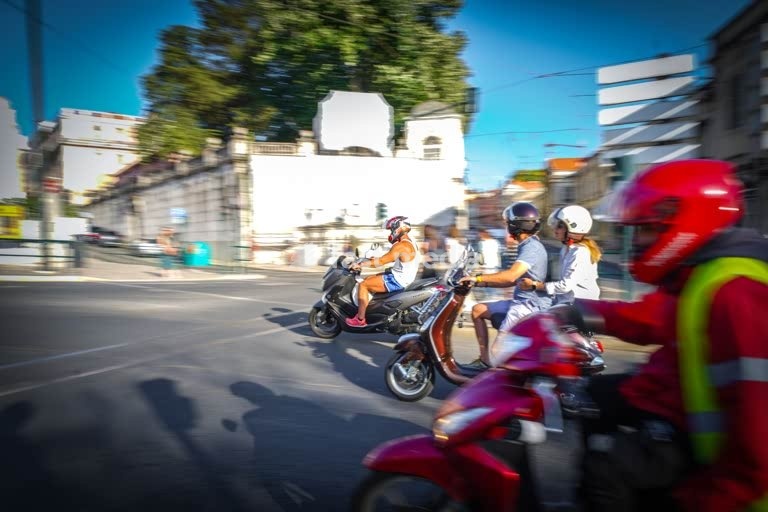 Lisbon, Portugal, young people on motorbikes on Largo de Rato. Motorcycle accidents have increased with rental bikes and deliveries.