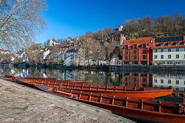 Traditional hunting boats on the Neckar River in Tübingen on a clear spring morning