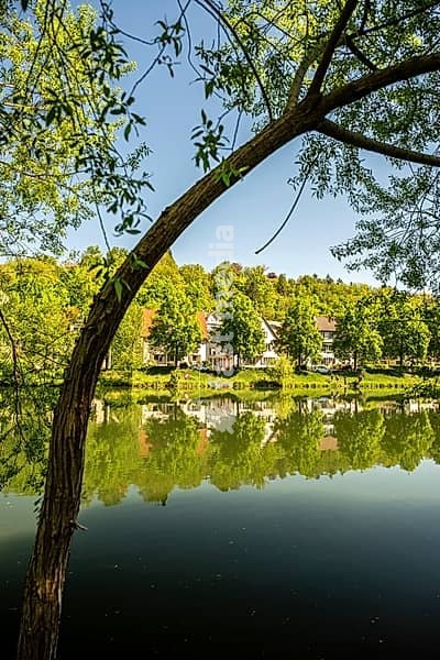Beautiful waterfront promenade of the Neckar River in Tübingen in spring