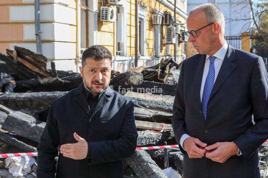 Ukrainian President Volodymyr Zelenskyy (L) and German Federal Chancellor Friedrich Merz, who arrived in the capital on a visit, speak to the media near the National Academy of Sciences of Ukraine building damaged by a Russian drone strike, Kyiv, Ukraine, on October 4, 2026. On September 28, a…
