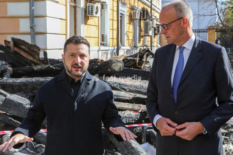 Ukrainian President Volodymyr Zelenskyy (L) and German Federal Chancellor Friedrich Merz, who arrived in the capital on a visit, speak to the media near the National Academy of Sciences of Ukraine building damaged by a Russian drone strike, Kyiv, Ukraine, on October 4, 2026. On September 28, a…