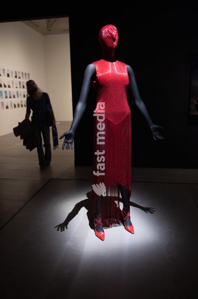 Visitors view 'Dress from Joan Collection' by Alexander McQueen at a Photocall for 'The 90s: Art And Fashion' which runs from 8th October 2026 - 14th February 2027 at TATE Britain in London, England, UK on Tuesday 6 October, 2026