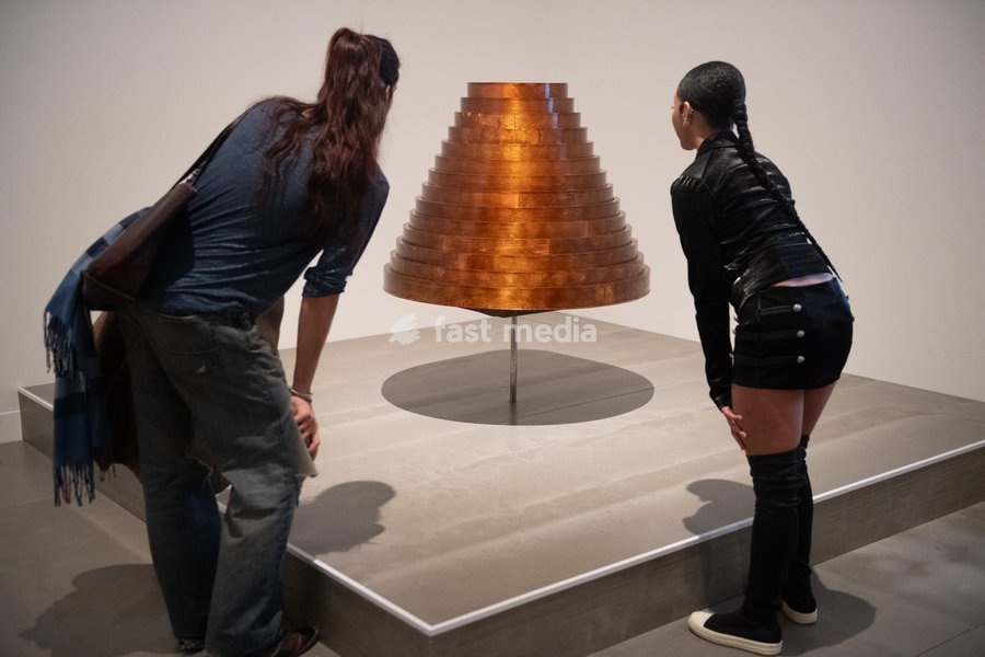 Visitors view 'Table Skirt from After Words Collection, autumn/winter 2000' by Hussein Chalayan at a Photocall for 'The 90s: Art And Fashion' which runs from 8th October 2026 - 14th February 2027 at TATE Britain in London, England, UK on Tuesday 6 October, 2026