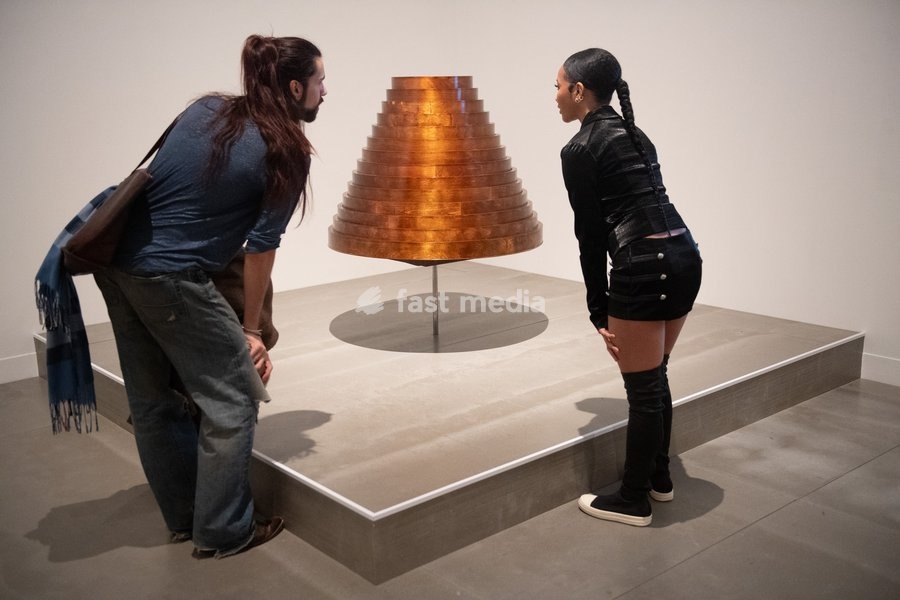 Visitors view 'Table Skirt from After Words Collection, autumn/winter 2000' by Hussein Chalayan at a Photocall for 'The 90s: Art And Fashion' which runs from 8th October 2026 - 14th February 2027 at TATE Britain in London, England, UK on Tuesday 6 October, 2026