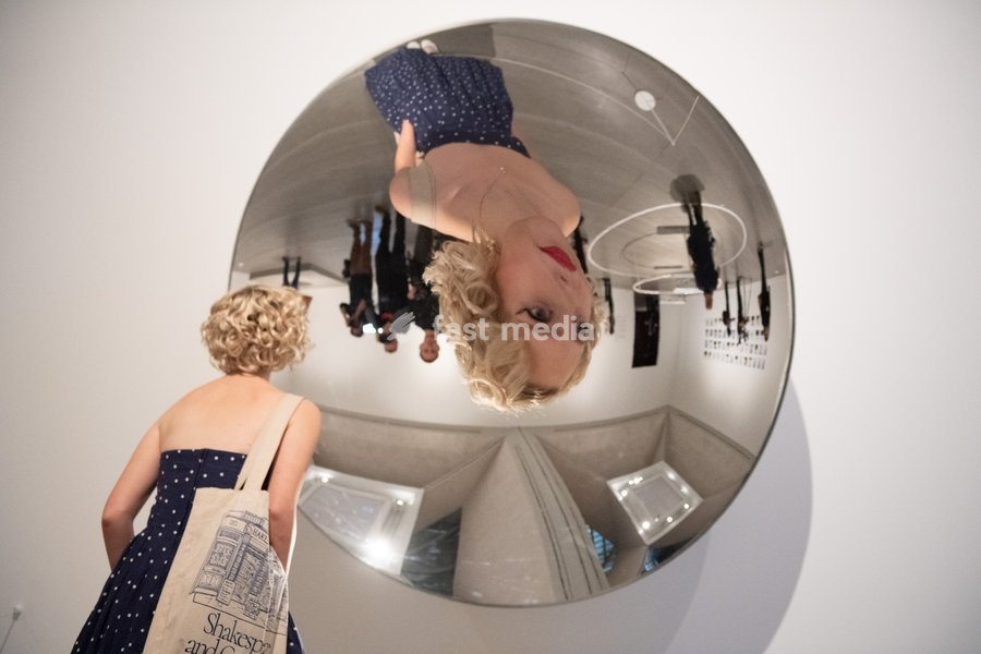 Visitors view 'Inverse Reverse Perverse' by Cerith Wyn Evans at a Photocall for 'The 90s: Art And Fashion' which runs from 8th October 2026 - 14th February 2027 at TATE Britain in London, England, UK on Tuesday 6 October, 2026