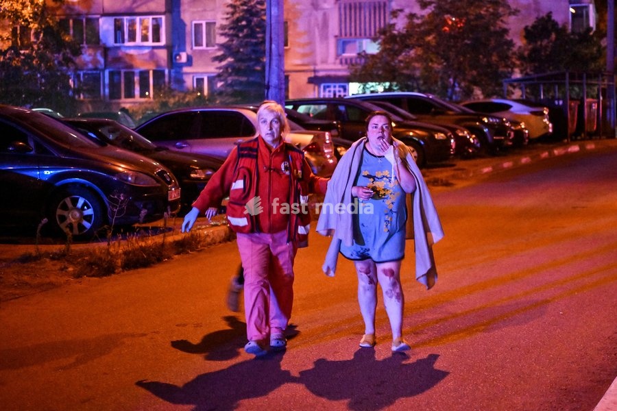 A medic escorts a woman who suffered burns in a Russian drone strike on a nine-story residential building to an ambulance in the Kosmichnyi district of Zaporizhzhia, Ukraine, on October 5, 2026. Five people were injured in the Russian attack, one of them seriously. Rescuers evacuated three people…