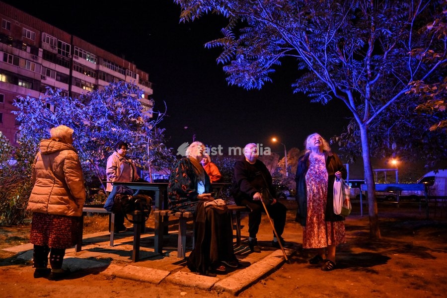 People watch efforts to eliminate the aftermath of a Russian strike on a nine-story residential building in the Kosmichnyi district of Zaporizhzhia, Ukraine, on October 5, 2026. Five people were injured in the Russian attack, one of them seriously. Rescuers evacuated three people who had been…