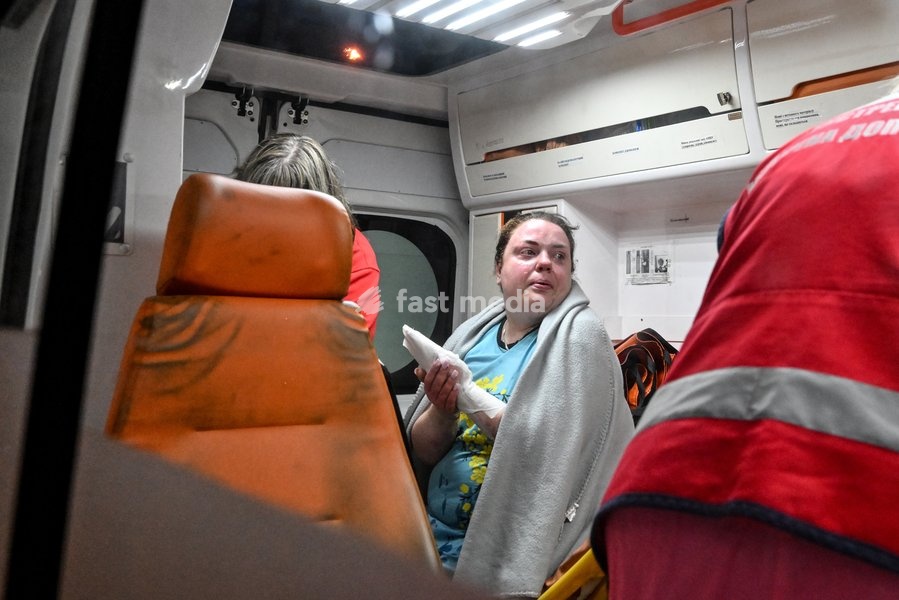 A woman who suffered burns in a Russian strike on a nine-story residential building receives medical treatment in an ambulance in the Kosmichnyi district of Zaporizhzhia, Ukraine, on October 5, 2026. Five people were injured in the Russian attack, one of them seriously. Rescuers evacuated three…