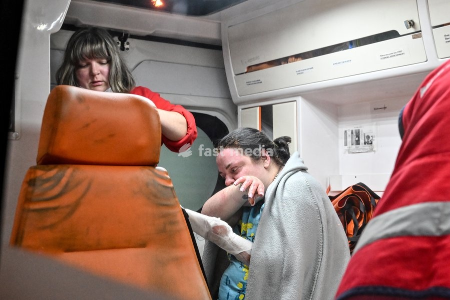 A woman who suffered burns in a Russian strike on a nine-story residential building receives medical treatment in an ambulance in the Kosmichnyi district of Zaporizhzhia, Ukraine, on October 5, 2026. Five people were injured in the Russian attack, one of them seriously. Rescuers evacuated three…