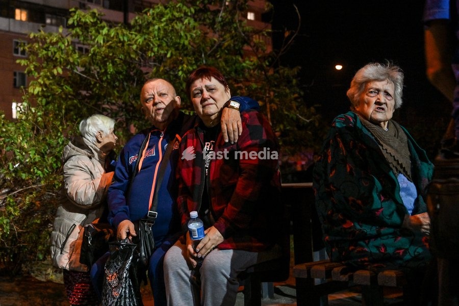 Evacuated residents of a nine-story residential building hit by a Russian drone sit on a bench during efforts to eliminate the aftermath of the Russian strike in Zaporizhzhia, Ukraine, on October 5, 2026. Five people were injured in the Russian attack, one of them seriously. Rescuers evacuated…