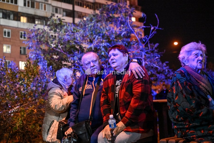 Evacuated residents of a nine-story residential building hit by a Russian drone sit on a bench during efforts to eliminate the aftermath of the Russian strike in Zaporizhzhia, Ukraine, on October 5, 2026. Five people were injured in the Russian attack, one of them seriously. Rescuers evacuated…