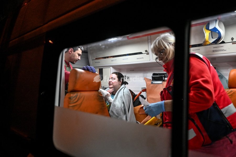 A woman who suffered burns in a Russian strike on a nine-story residential building receives medical treatment in an ambulance in the Kosmichnyi district of Zaporizhzhia, Ukraine, on October 5, 2026. Five people were injured in the Russian attack, one of them seriously. Rescuers evacuated three…