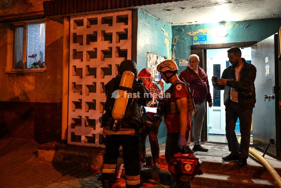 A rescuer evacuates a woman wearing an oxygen mask from a nine-story residential building hit by a Russian drone in Zaporizhzhia, Ukraine, on October 5, 2026. Five people were injured in the Russian attack, one of them seriously. Rescuers evacuated three people who had been trapped on the upper…