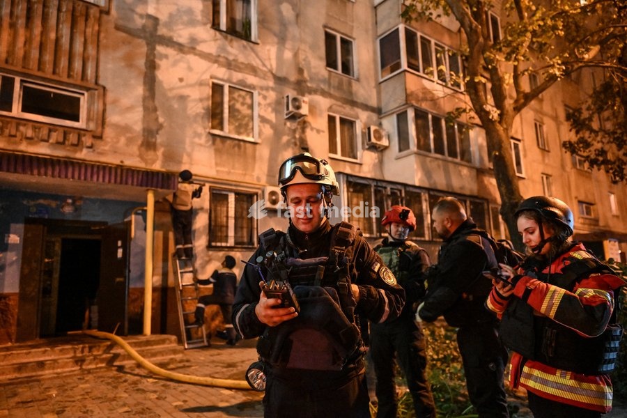 Rescuers and medics work during efforts to eliminate the aftermath of a Russian drone strike on a nine-story residential building in the Kosmichnyi district of Zaporizhzhia, Ukraine, on October 5, 2026. Five people were injured in the Russian attack, one of them seriously. Rescuers evacuated three…