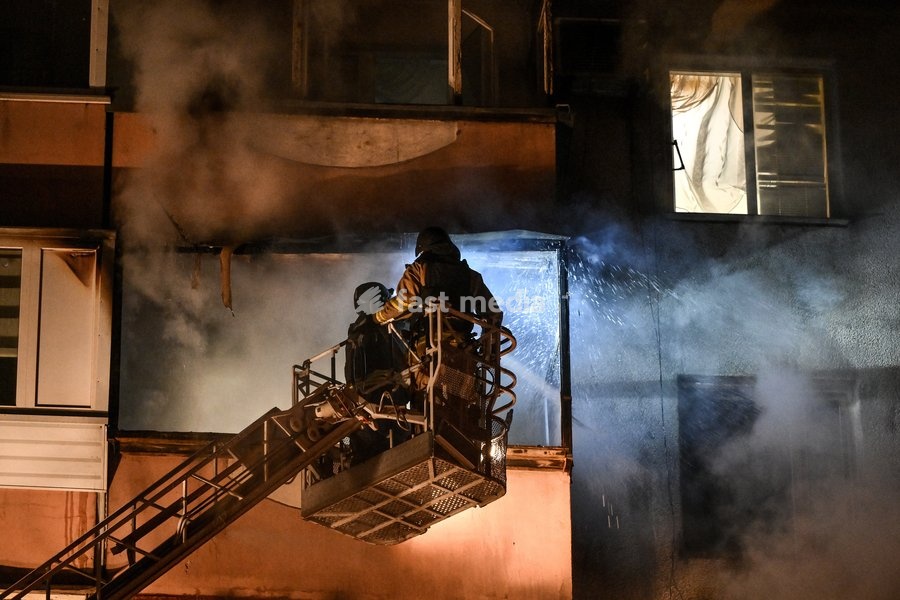 Rescuers in an aerial platform basket work to eliminate the aftermath of a Russian drone strike on a nine-story residential building in the Kosmichnyi district of Zaporizhzhia, Ukraine, on October 5, 2026. Five people were injured in the Russian attack, one of them seriously. Rescuers evacuated…