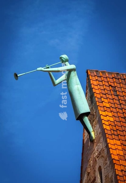 Trompet player on St. Magni church, Braunschweig Altstadt, Lower Saxony, Germany. Most of the city was destroyed in WWII.