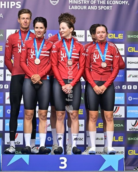 Third placed Team Luxembourg celebrates on the podium of the time trial mixed relay elite race (44,2 km) at the cycling UEC Road European Championships, in Ljubljana, Slovenia Tuesday 6 October 2026. The UEC Road European Championships are taking place from 02 to 07 October in Ljubljana, Slovenia
