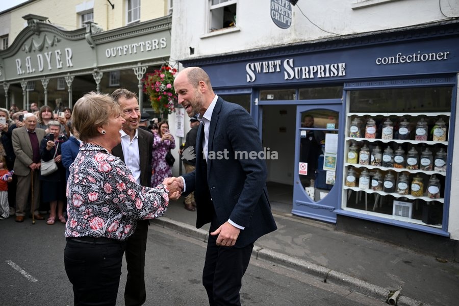 ILMINSTER, ENGLAND - OCTOBER 06: Prince William, Prince of Wales shakes hands with Jane Morgan, the owner of Sweet Surprise, during his visit to Sweet Surprise cafe on October 06, 2026 in Ilminster, England. The Prince of Wales visited Ilminster in Somerset to learn about communities growing their…