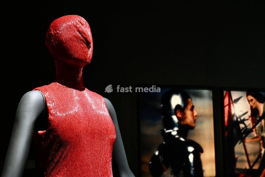 London, UK. Red Dress by Alexander McQueen. Art & Fashion, Tate Britain. Tate Britain has opened the first exhibition to explore the art, photography and fashion of the 1990s, adecade synonymous with possibility, optimism and an audacious spirit. The 90s : Art and Fashion explores this period's…