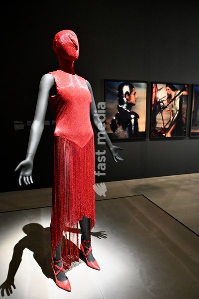 London, UK. Red Dress by Alexander McQueen. Art & Fashion, Tate Britain. Tate Britain has opened the first exhibition to explore the art, photography and fashion of the 1990s, adecade synonymous with possibility, optimism and an audacious spirit. The 90s : Art and Fashion explores this period's…
