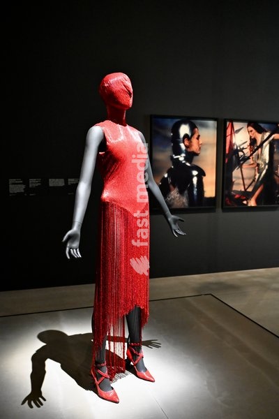 London, UK. Red Dress by Alexander McQueen. Art & Fashion, Tate Britain. Tate Britain has opened the first exhibition to explore the art, photography and fashion of the 1990s, adecade synonymous with possibility, optimism and an audacious spirit. The 90s : Art and Fashion explores this period's…
