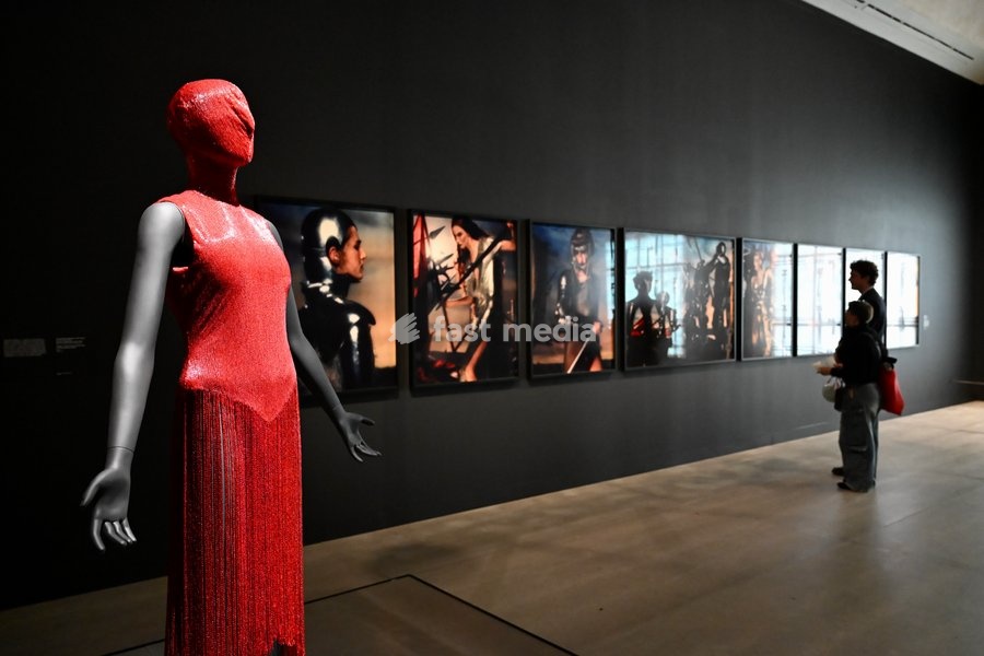 London, UK. Red Dress by Alexander McQueen. Art & Fashion, Tate Britain. Tate Britain has opened the first exhibition to explore the art, photography and fashion of the 1990s, adecade synonymous with possibility, optimism and an audacious spirit. The 90s : Art and Fashion explores this period's…
