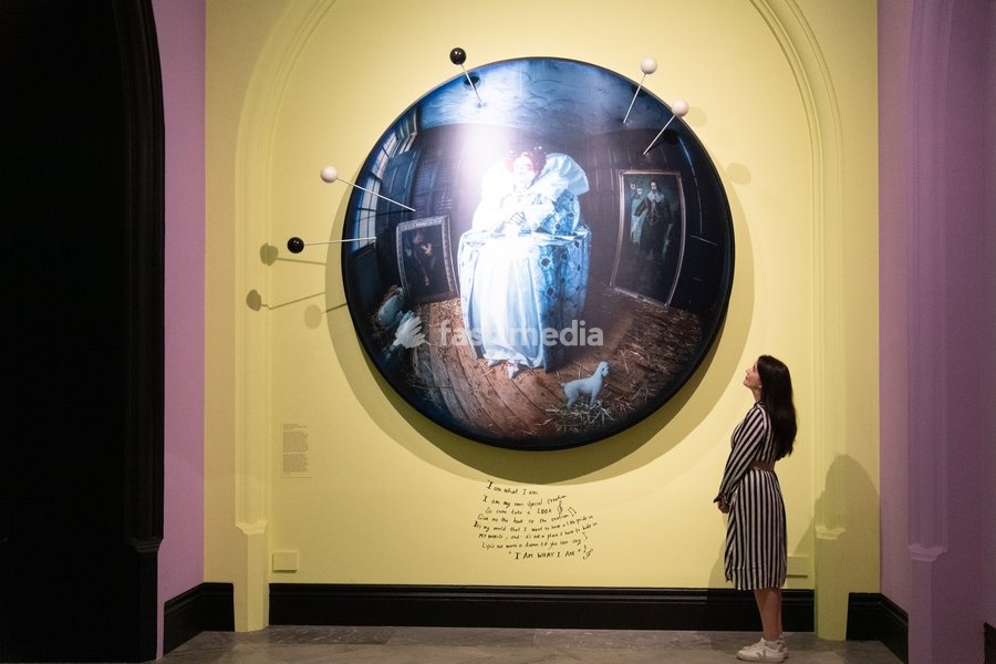 A staff member views 'Liz Carr as Elizabeth I' by Tim Walker as part of The National Portrait Gallery's 'Tim Walker's Fairyland: Love and Legends' Exhibition which runs from 9th October 2026 - 7th February 2027 at National Portrait Gallery in London, England, UK on Wednesday 7 October, 2026
