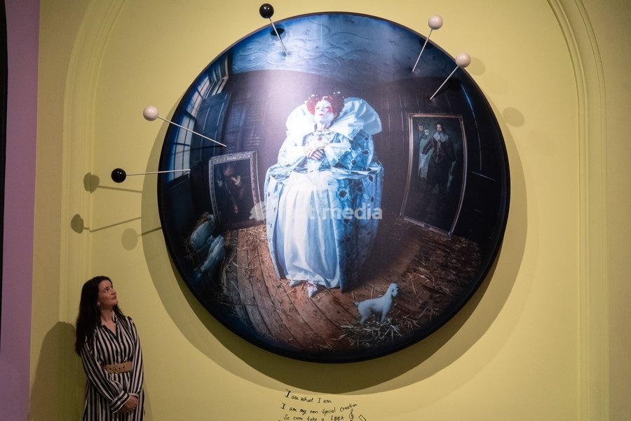 A staff member views 'Liz Carr as Elizabeth I' by Tim Walker as part of The National Portrait Gallery's 'Tim Walker's Fairyland: Love and Legends' Exhibition which runs from 9th October 2026 - 7th February 2027 at National Portrait Gallery in London, England, UK on Wednesday 7 October, 2026