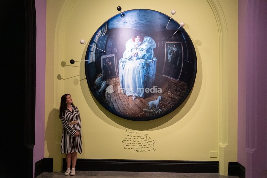 A staff member views 'Liz Carr as Elizabeth I' by Tim Walker as part of The National Portrait Gallery's 'Tim Walker's Fairyland: Love and Legends' Exhibition which runs from 9th October 2026 - 7th February 2027 at National Portrait Gallery in London, England, UK on Wednesday 7 October, 2026