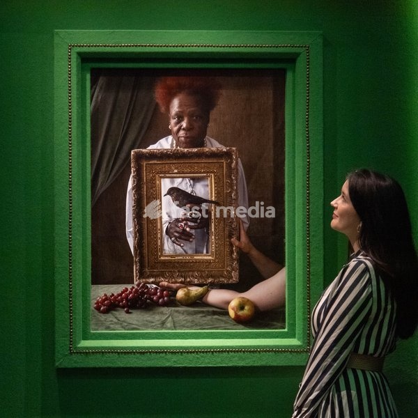 A staff member views 'Olivette Cole-Wilson, and blackbird' by Tim Walker as part of The National Portrait Gallery's 'Tim Walker's Fairyland: Love and Legends' Exhibition which runs from 9th October 2026 - 7th February 2027 at National Portrait Gallery in London, England, UK on Wednesday 7 October,…