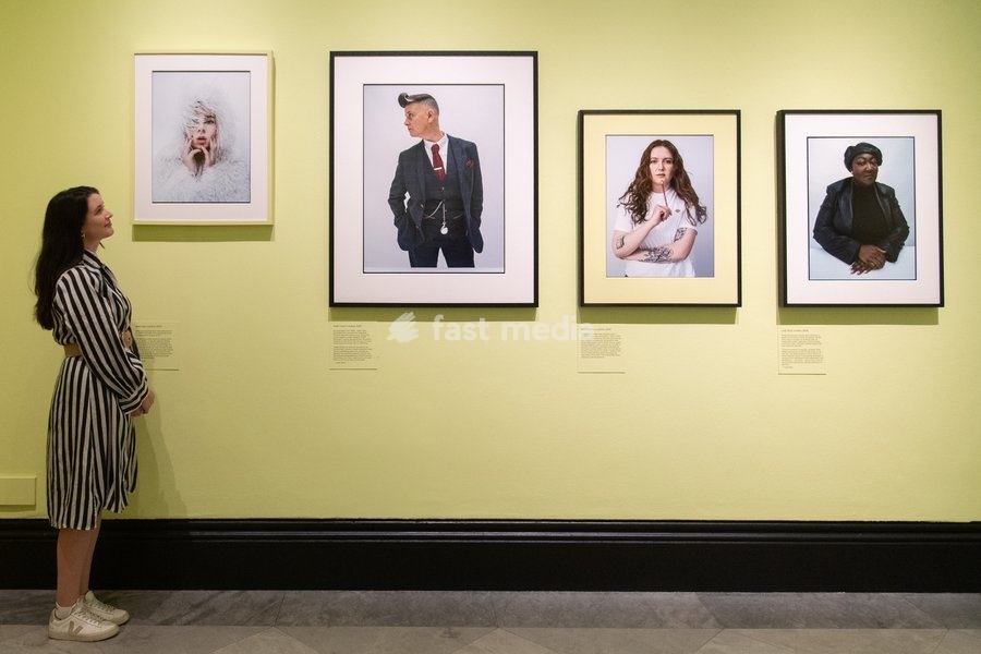 A staff member views (L-R) - 'Shon Faye', 'Joelle Taylor', 'Alice Oseman', 'Lady Phill' all by Tim Walker as part of The National Portrait Gallery's 'Tim Walker's Fairyland: Love and Legends' Exhibition which runs from 9th October 2026 - 7th February 2027 at National Portrait Gallery in London,…
