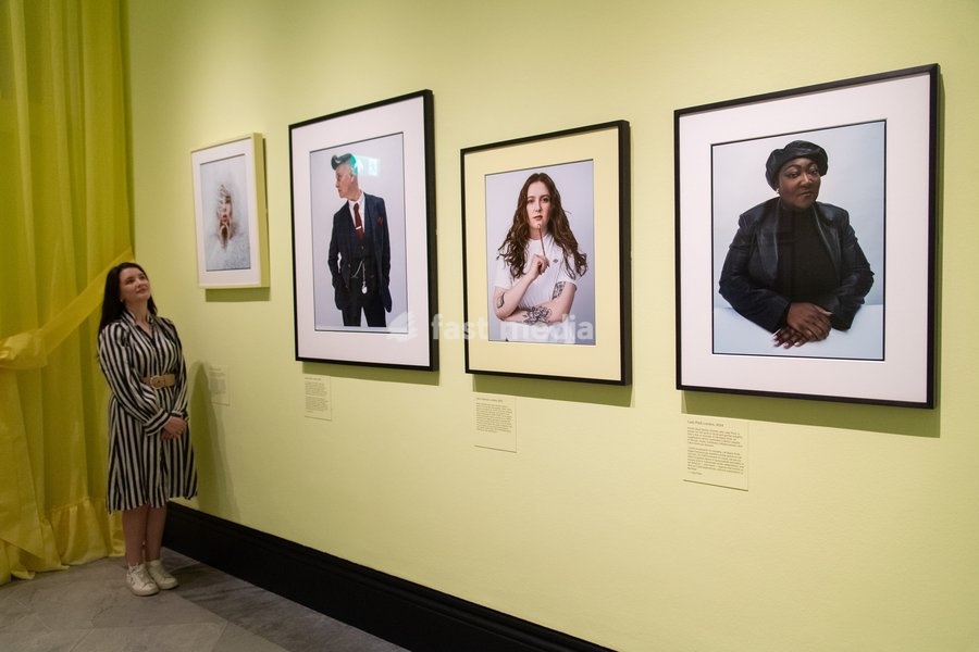 A staff member views (L-R) - 'Shon Faye', 'Joelle Taylor', 'Alice Oseman', 'Lady Phill' all by Tim Walker as part of The National Portrait Gallery's 'Tim Walker's Fairyland: Love and Legends' Exhibition which runs from 9th October 2026 - 7th February 2027 at National Portrait Gallery in London,…