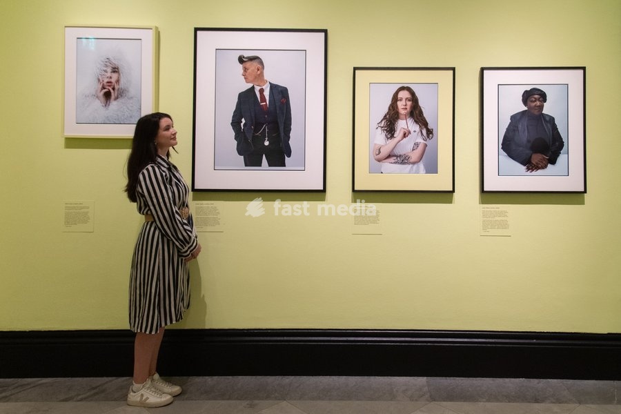 A staff member views (L-R) - 'Shon Faye', 'Joelle Taylor', 'Alice Oseman', 'Lady Phill' all by Tim Walker as part of The National Portrait Gallery's 'Tim Walker's Fairyland: Love and Legends' Exhibition which runs from 9th October 2026 - 7th February 2027 at National Portrait Gallery in London,…