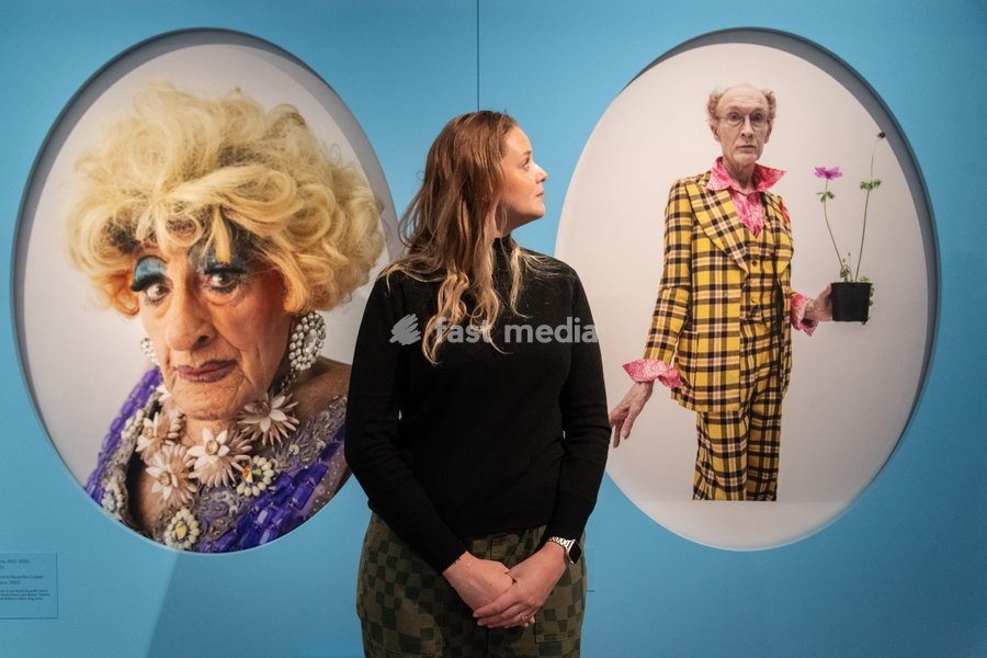 A staff member views (L-R) - 'Maisie Trollette' and 'Lavinia Co-op and Japanese Anemone' all by Tim Walker as part of The National Portrait Gallery's 'Tim Walker's Fairyland: Love and Legends' Exhibition which runs from 9th October 2026 - 7th February 2027 at National Portrait Gallery in London,…