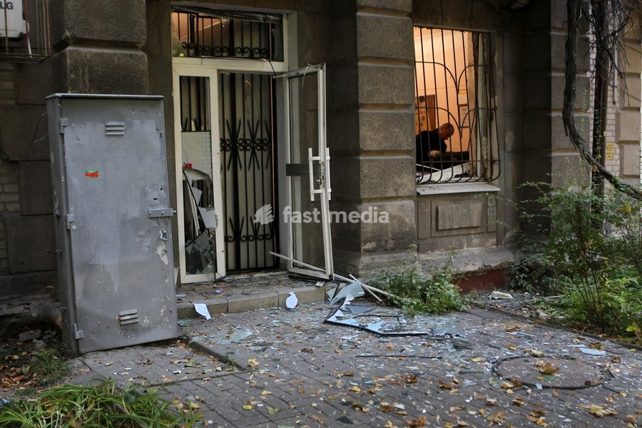 A man is seen through a window of a building shattered in a Russian missile strike, Dnipro, Ukraine, on October 6, 2026. Russian forces attacked Dnipro with missiles, damaging an industrial enterprise, apartment buildings, and a sports club
