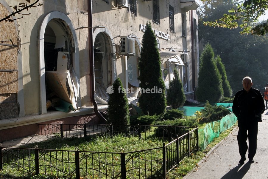 A man walks past a building damaged in a Russian missile strike, Dnipro, Ukraine, on October 6, 2026. Russian forces attacked Dnipro with missiles, damaging an industrial enterprise, apartment buildings, and a sports club
