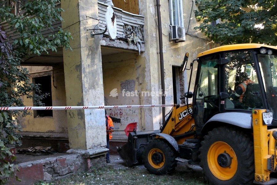 Municipal equipment works during efforts to eliminate the aftermath of a Russian missile strike on a residential building, Dnipro, Ukraine, on October 6, 2026. Russian forces attacked Dnipro with missiles, damaging an industrial enterprise, apartment buildings, and a sports club