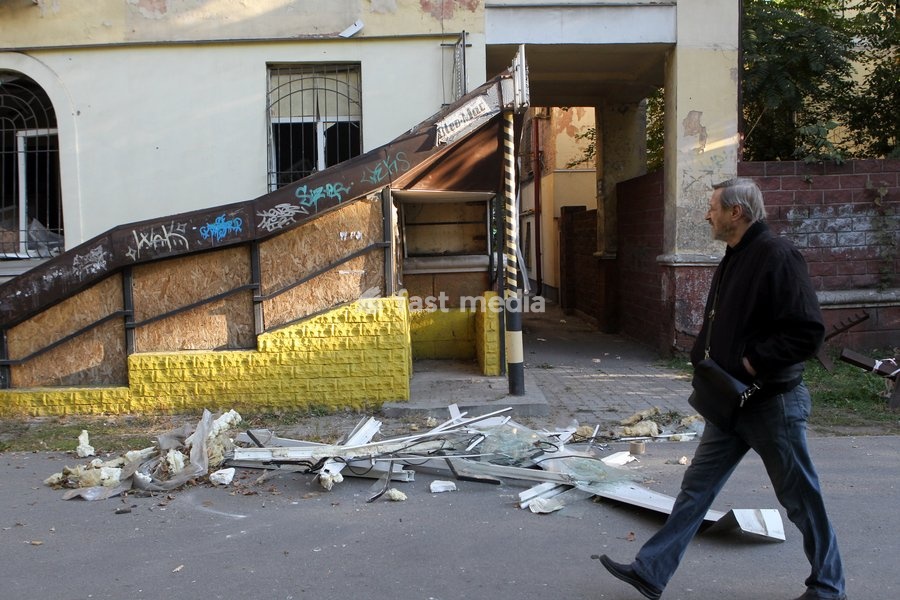 A man walks past a building damaged in a Russian missile strike, Dnipro, Ukraine, on October 6, 2026. Russian forces attacked Dnipro with missiles, damaging an industrial enterprise, apartment buildings, and a sports club