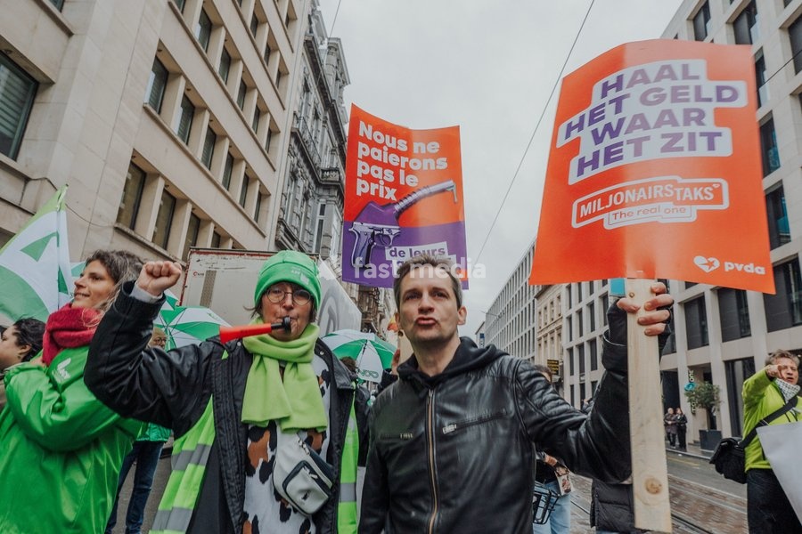 Protestors gather at the headquarters of conservative Flemish nationalist party N-VA, during a national manifestation against the Federal Government's budgetary measures, under the 'Keep your hands out of our pockets!' (Blijf uit onze zakken! - Pas dans nos poches) moniker, organized by the trade…