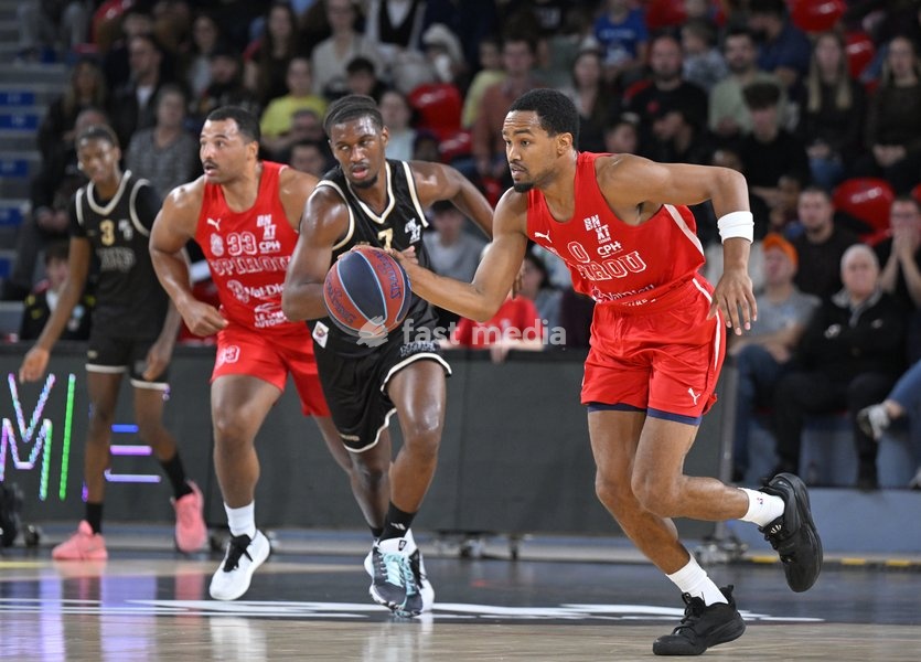 Spirou's Sam Hofman; Mons' Kylian Mpete and Spirou's Nigel Hawkins are pictured during a basketball match between Spirou Charleroi and CityX Mons-Hainaut, Friday 9 October 2026 in Charleroi, on the opening day of the 'BNXT League' Belgian and Dutch first division basket championships