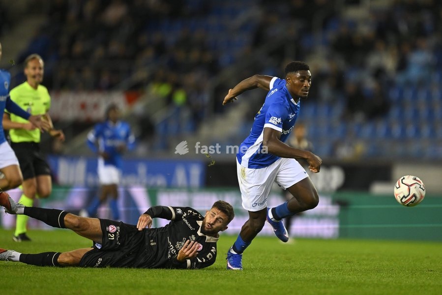 Kortrijk's Axel Drouhin and Genk's Rafiu Durosinmi fight for the ball during a soccer match between KRC Genk and KV Kortrijk, Saturday 10 October 2026 in Genk, on day 8 of the 2026-2027 'Jupiler Pro League' first division of the Belgian championship, in Genk