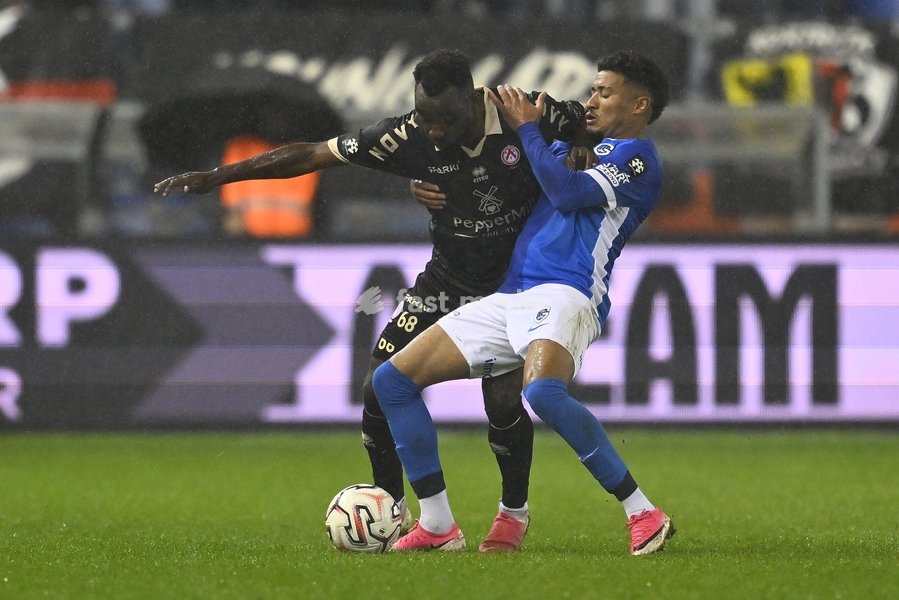 Kortrijk's Thierry Ambrose and Genk's Kevin Amaro fight for the ball during a soccer match between KRC Genk and KV Kortrijk, Saturday 10 October 2026 in Genk, on day 8 of the 2026-2027 'Jupiler Pro League' first division of the Belgian championship, in Genk