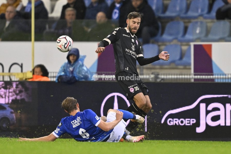 Genk's Matte Smets and Kortrijk's Boris Lambert fight for the ball during a soccer match between KRC Genk and KV Kortrijk, Saturday 10 October 2026 in Genk, on day 8 of the 2026-2027 'Jupiler Pro League' first division of the Belgian championship, in Genk