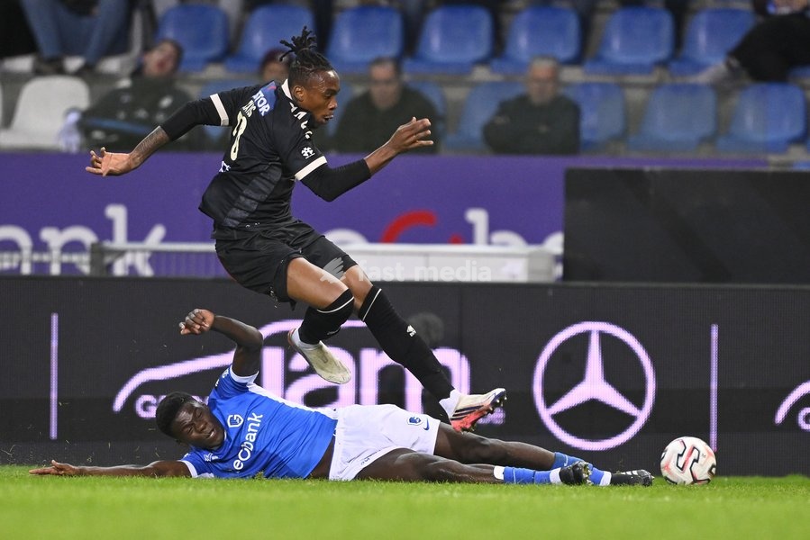 Genk's Josue Kongolo and Kortrijk's Sixtus Ogbuehi fight for the ball during a soccer match between KRC Genk and KV Kortrijk, Saturday 10 October 2026 in Genk, on day 8 of the 2026-2027 'Jupiler Pro League' first division of the Belgian championship, in Genk