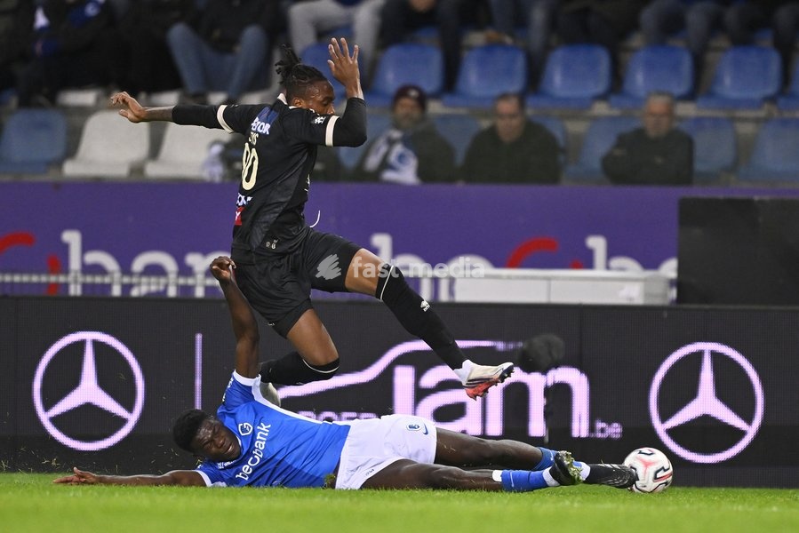 Genk's Josue Kongolo and Kortrijk's Sixtus Ogbuehi fight for the ball during a soccer match between KRC Genk and KV Kortrijk, Saturday 10 October 2026 in Genk, on day 8 of the 2026-2027 'Jupiler Pro League' first division of the Belgian championship, in Genk